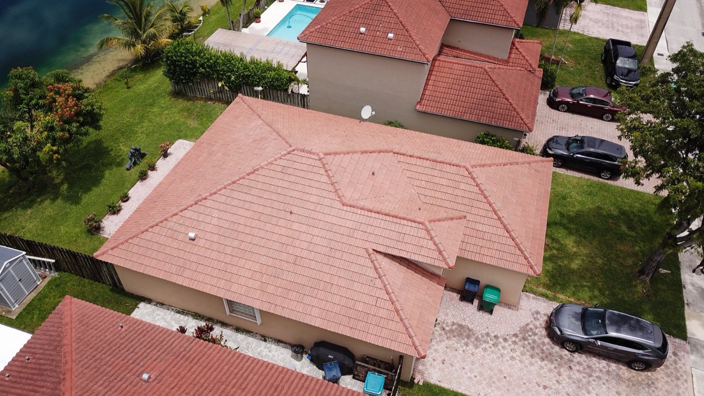Aerial view of a completed barrel tile roof on a single story Miami home